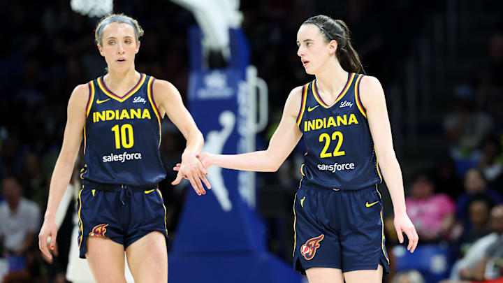 May 3, 2024; Dallas, Texas, USA; Indiana Fever guard Caitlin Clark (22) celebrates with Indiana Fever guard Lexie Hull (10) during the second quarter against the Dallas Wings at College Park Center.  Mandatory Credit: Kevin Jairaj-Imagn Images