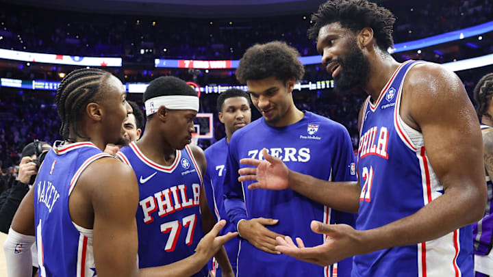 Jan 29, 2026; Philadelphia, Pennsylvania, USA; Philadelphia 76ers center Joel Embiid (21) reacts with Philadelphia 76ers guard Tyrese Maxey (L) in front of guard Vj Edgecombe (77) after a victory against the Sacramento Kings at Xfinity Mobile Arena. Mandatory Credit: Bill Streicher-Imagn Images