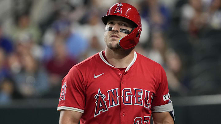 Apr 17, 2025; Arlington, Texas, USA; Los Angeles Angels right fielder Mike Trout (27) looks on after striking out against the Texas Rangers during the first inning at Globe Life Field. Mandatory Credit: Jim Cowsert-Imagn Images