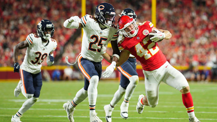 Adrian Colbert (25) tries to bring down Chiefs back Carson Steele during a preseason game this year.