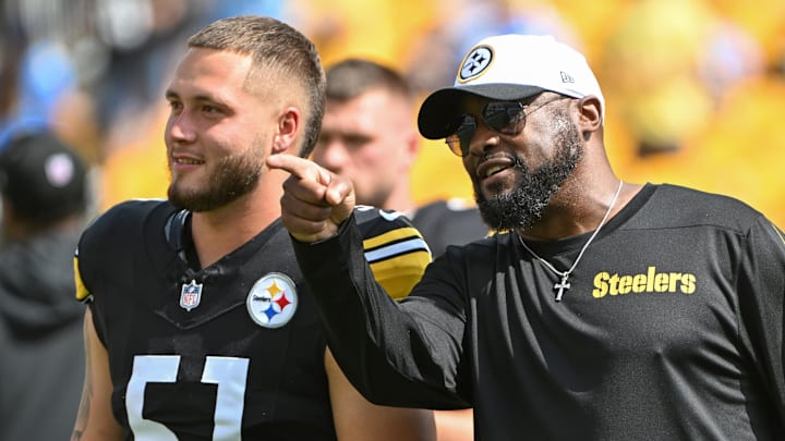 Sep 22, 2024; Pittsburgh, Pennsylvania, USA; Pittsburgh Steelers head coach Mike Tomlin talks with linebacker Nick Herbig (51) before a game against the Los Angeles Chargers at Acrisure Stadium. Mandatory Credit: Barry Reeger-Imagn Images