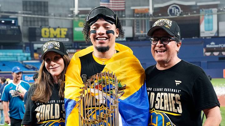 Milwaukee Brewers catcher William Contreras (24) takes a photo with Brewers owner Mark Attanasio, right, and his wife Debbie Attanasio, left, after winning the World Series against the Tampa Bay Rays at Tropicana Field on in St.Petersburg, Florida on Oct. 28, 2026. Milwaukee Brewers catcher William Contreras (24) takes a photo with Brewers owner Mark Attanasio, right, and his wife Debbie Attanasio, left, after winning the World Series against the Tampa Bay Rays at Tropicana Field on in St.Petersburg, Florida on Oct. 28, 2026.