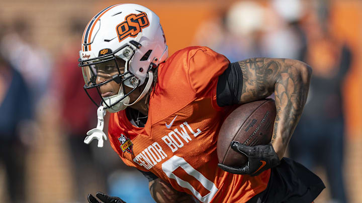 Jan 29, 2025; Mobile, AL, USA; National team running back Ollie Gordon II of Oklahoma State (0) runs the ball during Senior Bowl practice for the National team at Hancock Whitney Stadium. Mandatory Credit: Vasha Hunt-Imagn Images