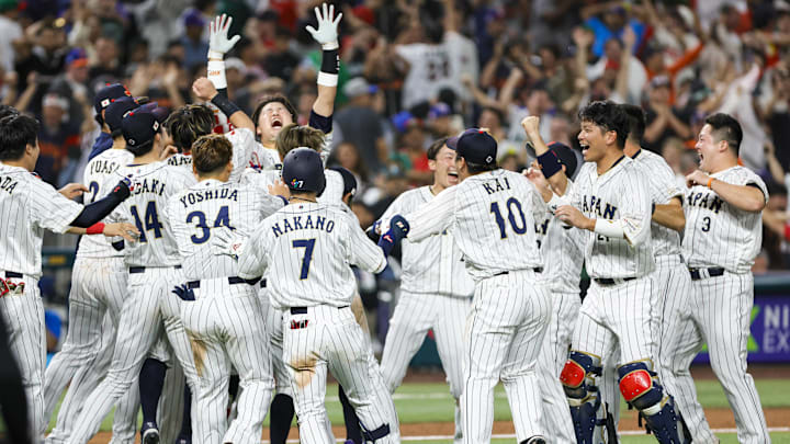 Team Japan celebrates on the field after winning the game with a walk-off double from Japan third baseman Munetaka Murakami (55) during the ninth inning against Mexico at LoanDepot Park in the championship game of the 2023 World Baseball Classic.