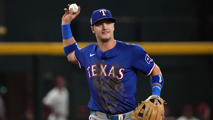 Sep 11, 2024; Phoenix, Arizona, USA; Texas Rangers third base Josh Jung (6) makes the play for an out against the Arizona Diamondbacks in the first inning at Chase Field