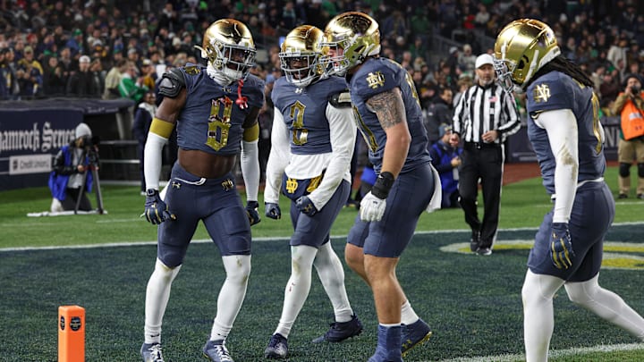 Nov 23, 2024; New York, New York, USA; Notre Dame Fighting Irish safety Adon Shuler (8) and Notre Dame Fighting Irish linebacker Jaylen Sneed (3) celebrate a defense stop during the first half against the Army Black Knights at Yankee Stadium. 