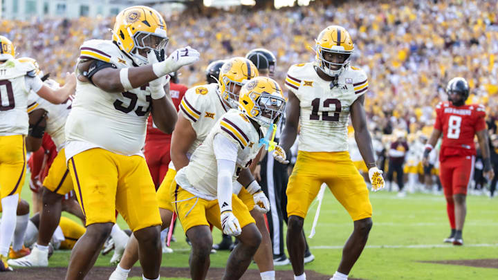 Oct 18, 2025; Tempe, Arizona, USA; Arizona State Sun Devils running back Raleek Brown (3) celebrates with offensive lineman Josh Atkins (53) and wide receiver Malik McClain (12) after scoring a touchdown against the Texas Tech Red Raiders in the fourth quarter at Mountain America Stadium. Mandatory Credit: Mark J. Rebilas-Imagn Images Oct 18, 2025; Tempe, Arizona, USA; Arizona State Sun Devils running back Raleek Brown (3) celebrates with offensive lineman Josh Atkins (53) and wide receiver Malik McClain (12) after scoring a touchdown against the Texas Tech Red Raiders in the fourth quarter at Mountain America Stadium. Mandatory Credit: Mark J. Rebilas-Imagn Images