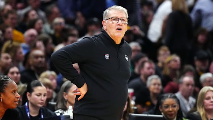 Apr 5, 2024; Cleveland, OH, USA; Connecticut Huskies head coach Geno Auriemma looks on in the first quarter against the Iowa Hawkeyes in the semifinals of the Final Four of the womens 2024 NCAA Tournament at Rocket Mortgage FieldHouse. Mandatory Credit: Kirby Lee-Imagn Images