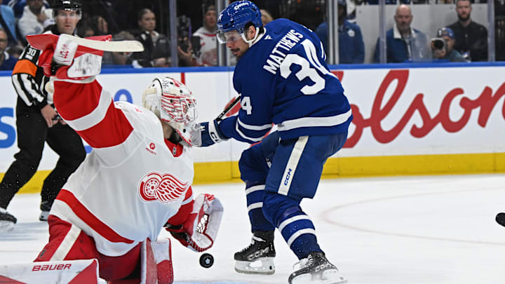 Oct 13, 2025; Toronto, Ontario, CAN; Detroit Red Wings goalie Cameron Talbot (39) makes a save on Toronto Maple Leafs center Auston Matthews (34) in the third period at Scotiabank Arena. Mandatory Credit: Gerry Angus-Imagn Images