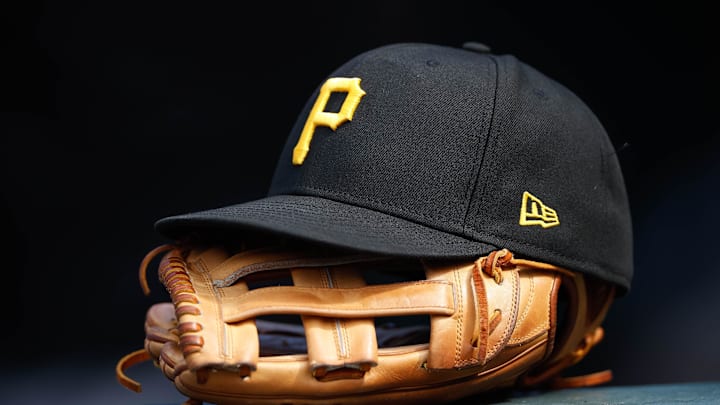 Jun 30, 2021; Denver, Colorado, USA; A general view of a Pittsburgh Pirates glove and hat in the eighth inning against the Colorado Rockies at Coors Field. Mandatory Credit: Isaiah J. Downing-Imagn Images Jun 30, 2021; Denver, Colorado, USA; A general view of a Pittsburgh Pirates glove and hat in the eighth inning against the Colorado Rockies at Coors Field. Mandatory Credit: Isaiah J. Downing-Imagn Images