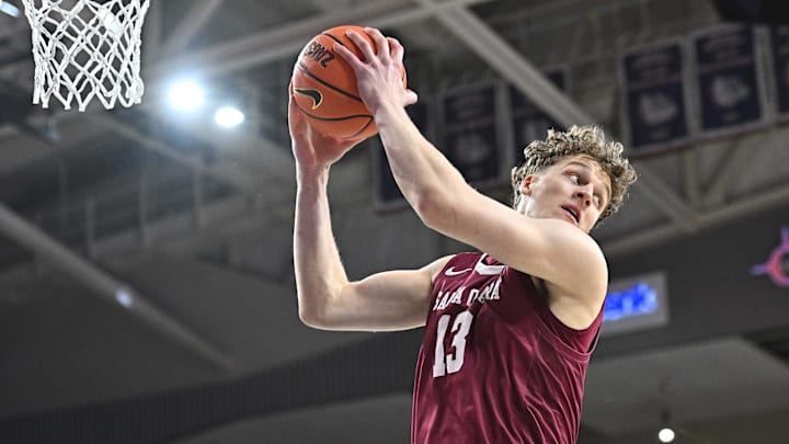 Jan 18, 2025; Spokane, Washington, USA; Santa Clara Broncos center Christoph Tilly (13) rebounds the ball against the Gonzaga Bulldogs in the first half at McCarthey Athletic Center. Mandatory Credit: James Snook-Imagn Images