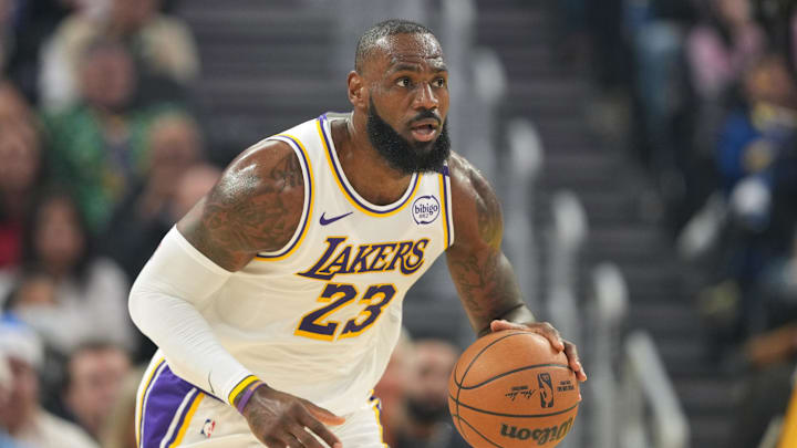 Dec 25, 2024; San Francisco, California, USA; Los Angeles Lakers forward LeBron James (23) dribbles against the Golden State Warriors during the first quarter at Chase Center. Mandatory Credit: Darren Yamashita-Imagn Images