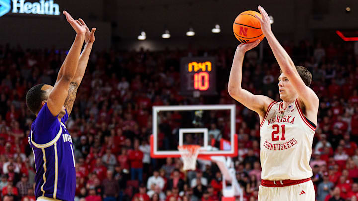 Pryce Sandfort (21) of Nebraska shoots a 3-pointer over the UW's Bryson Tucker. Pryce Sandfort (21) of Nebraska shoots a 3-pointer over the UW's Bryson Tucker.