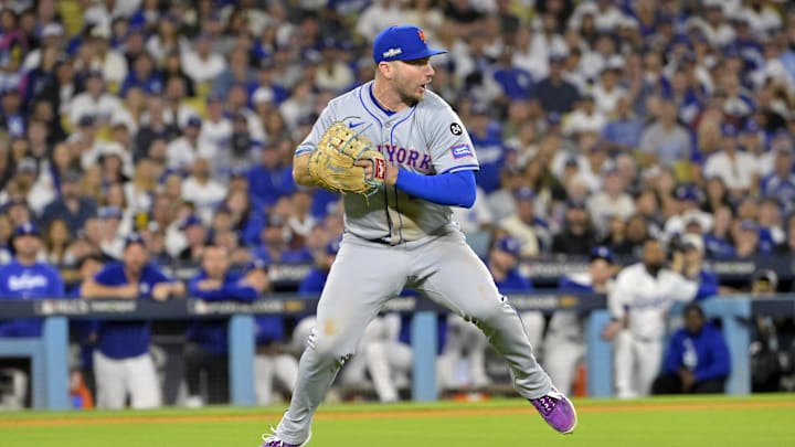 Oct 20, 2024; Los Angeles, California, USA; New York Mets first baseman Pete Alonso (20) fields the ball hit by Los Angeles Dodgers second baseman Chris Taylor (not pictured) in the sixth inning during game six of the NLCS for the 2024 MLB playoffs at Dodger Stadium. Mandatory Credit: Jayne Kamin-Oncea-Imagn Images
