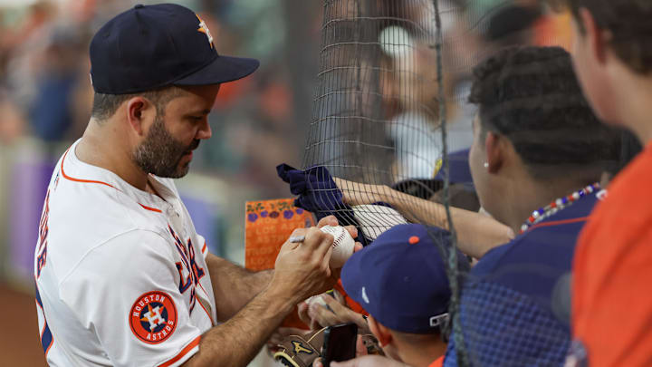 Sep 21, 2024; Houston, Texas, USA;  Houston Astros second baseman Jose Altuve (27) signs autographs before playing against the Los Angeles Angels at Minute Maid Park. 