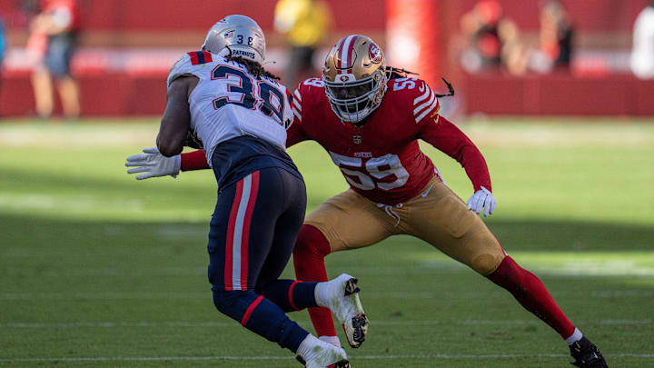 Sep 29, 2024; Santa Clara, California, USA; San Francisco 49ers linebacker De'Vondre Campbell (59) tackles New England Patriots running back Rhamondre Stevenson (38) during the fourth quarter at Levi's Stadium. Mandatory Credit: Neville E. Guard-Imagn Images