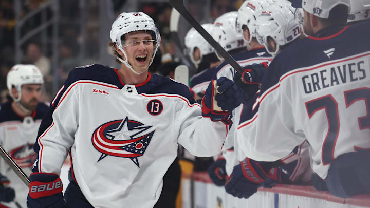 Mar 21, 2025; Pittsburgh, Pennsylvania, USA;  Columbus Blue Jackets center Kent Johnson (91) celebrates with the  Blue Jackets bench after scoring a goal against the Pittsburgh Penguins during the third period at PPG Paints Arena. Mandatory Credit: Charles LeClaire-Imagn Images