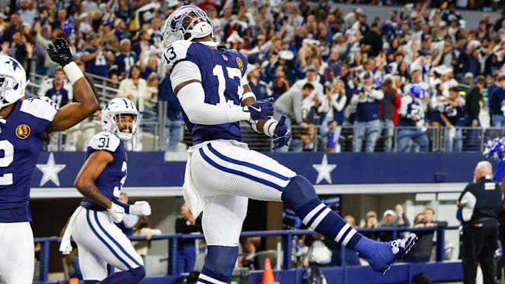 Dallas Cowboys linebacker DeMarvion Overshown celebrates his interception touchdown return against the New York Giants.