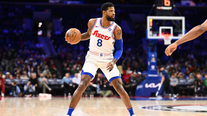 Feb 11, 2025; Philadelphia, Pennsylvania, USA; Philadelphia 76ers forward Paul George (8) controls the ball against the Toronto Raptors in the first quarter at Wells Fargo Center. Mandatory Credit: Kyle Ross-Imagn Images