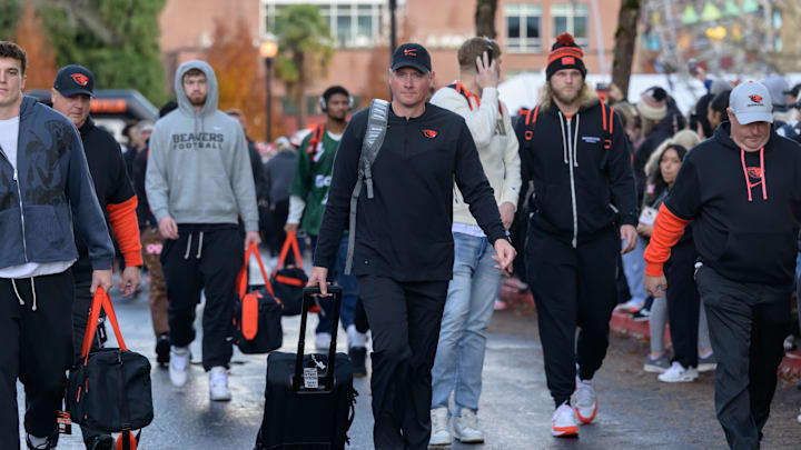 Nov 23, 2024; Corvallis, Oregon, USA; Oregon State Beavers head coach Trent Bray (center) leads his team to the locker room before a game against the Washington State Cougars at Reser Stadium. Mandatory Credit: Craig Strobeck-Imagn Images Nov 23, 2024; Corvallis, Oregon, USA; Oregon State Beavers head coach Trent Bray (center) leads his team to the locker room before a game against the Washington State Cougars at Reser Stadium. Mandatory Credit: Craig Strobeck-Imagn Images