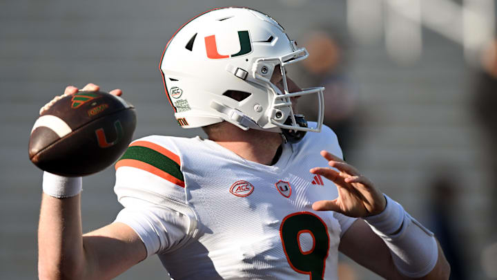 Nov 24, 2023; Chestnut Hill, Massachusetts, USA; Miami Hurricanes quarterback Tyler Van Dyke (9) makes a pass during warmups before a game against the Boston College Eagles at Alumni Stadium. Mandatory Credit: Brian Fluharty-USA TODAY Sports