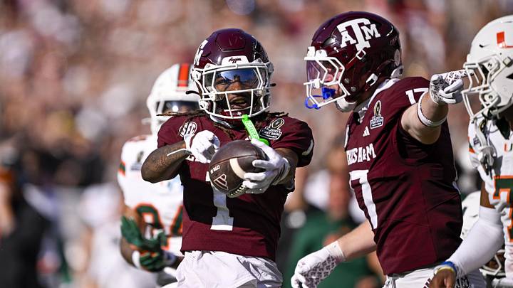Texas A&M Aggies wide receiver Mario Craver and tight end Theo Melin Ohrstrom celebrate during the game between the Aggies and the Miami Hurricanes at Kyle Field.