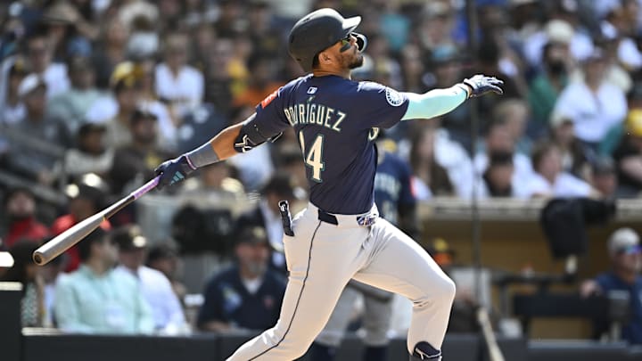 Seattle Mariners outfielder Julio Rodriguez hits a single during a game against the San Diego Padres on May 18 at Petco Park. Seattle Mariners outfielder Julio Rodriguez hits a single during a game against the San Diego Padres on May 18 at Petco Park.