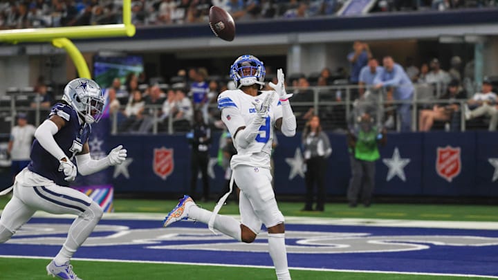 Oct 13, 2024; Arlington, Texas, USA;  Detroit Lions wide receiver Jameson Williams (9) catches a touchdown pass past Dallas Cowboys cornerback Trevon Diggs (7) during the second half at AT&T Stadium. Mandatory Credit: Kevin Jairaj-Imagn Images