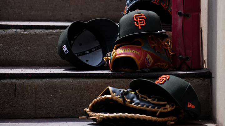 Apr 16, 2026; Cincinnati, Ohio, USA; A view of San Francisco Giants game hats on the dugout steps during the game against the Cincinnati Reds at Great American Ball Park. Mandatory Credit: Aaron Doster-Imagn Images
