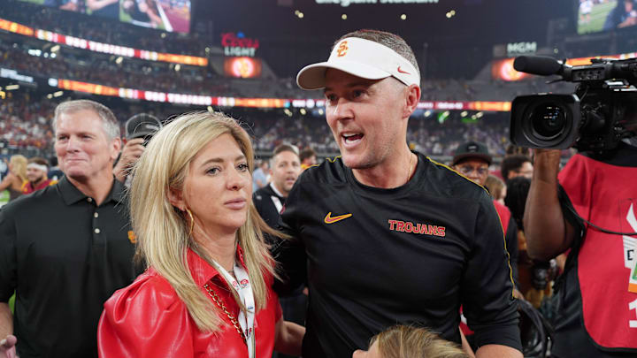 Sep 1, 2024; Paradise, Nevada, USA; Southern California Trojans head coach Lincoln Riley with wife Caitlin Riley after the game against the LSU Tigers at Allegiant Stadium. Mandatory Credit: Kirby Lee-Imagn Images Sep 1, 2024; Paradise, Nevada, USA; Southern California Trojans head coach Lincoln Riley with wife Caitlin Riley after the game against the LSU Tigers at Allegiant Stadium. Mandatory Credit: Kirby Lee-Imagn Images