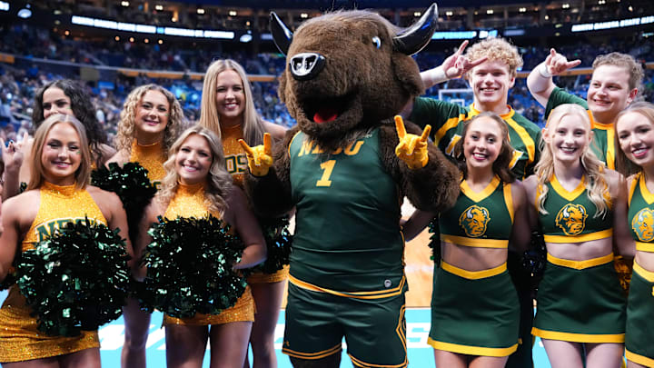 Mar 19, 2026; Buffalo, NY, USA; The North Dakota State Bison mascot and cheerleaders pose for a photo before the game against the Michigan State Spartans during a first round game of the men's 2026 NCAA Tournament at Keybank Center. Mar 19, 2026; Buffalo, NY, USA; The North Dakota State Bison mascot and cheerleaders pose for a photo before the game against the Michigan State Spartans during a first round game of the men's 2026 NCAA Tournament at Keybank Center.