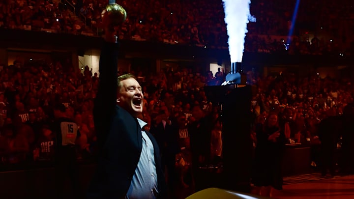 May 4, 2025; Cleveland, Ohio, USA; Former Cleveland Cavaliers player Mark Price pulls a sword out of a Cavs logo before game one of the second round against the Indiana Pacers for the 2025 NBA Playoffs at Rocket Arena. Mandatory Credit: Ken Blaze-Imagn Images