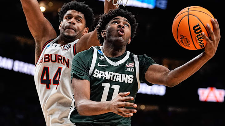 Michigan State guard Jase Richardson (11) goes to the basket against Auburn center Dylan Cardwell (44) during the second half of the Elite Eight round of NCAA tournament at State Farm Arena in Atlanta, Ga. on Sunday, March 30, 2025.
