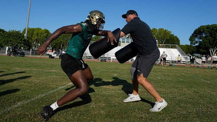 St. John Neumann High School football player Jayden Petit completes practice drills Tuesday morning July 29, 2025. St. John Neumann High School football player Jayden Petit completes practice drills Tuesday morning July 29, 2025.