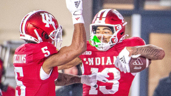 Indiana's Elijah Sarratt (13) celebrtes with Ke'Shawn Williams (5) after Sarratt's touchdown during the Indiana versus Purdue football game at Memorial Stadium on Saturday, Nov. 30, 2024.