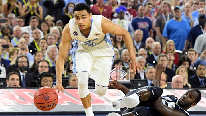 Apr 4, 2016; Houston, TX, USA; North Carolina Tar Heels guard Marcus Paige (5) gets past Villanova Wildcats forward Daniel Ochefu (23) to score a three point basket in the second half in the championship game of the 2016 NCAA Men's Final Four at NRG Stadium. Mandatory Credit: Robert Deutsch-Imagn Images