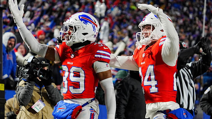 Buffalo Bills cornerback Cam Lewis celebrates with teammate Buffalo Bills safety Cole Bishop.