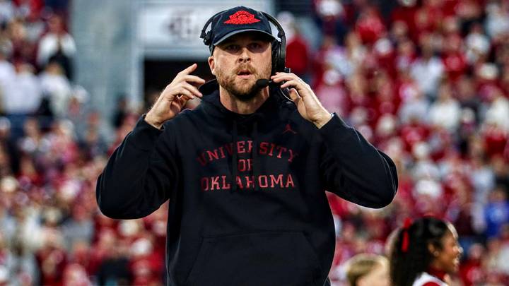 Oklahoma offensive coordinator Ben Arbuckle walks onto the field before facing Kentucky. Oklahoma offensive coordinator Ben Arbuckle walks onto the field before facing Kentucky.