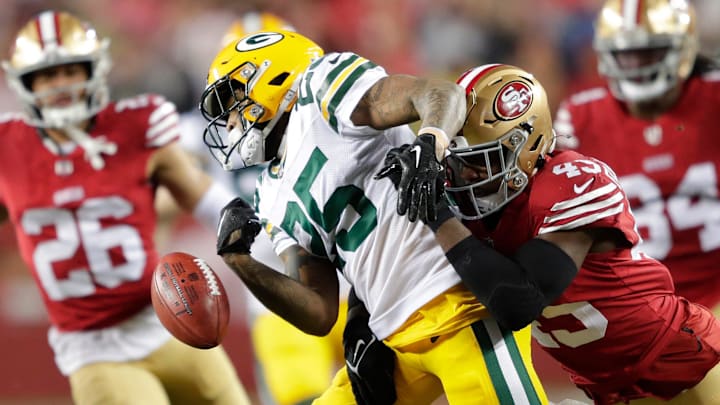 San Francisco 49ers linebacker Demetrius Flannigan-Fowles (45) forces a fumble by Green Bay Packers