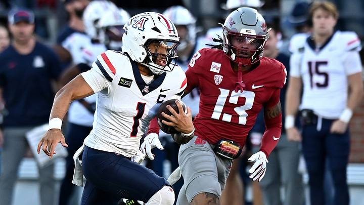  Arizona Wildcats quarterback Noah Fifita (1) carries the ball against Washington State Cougars cornerback Khamari Terrell (13) during the first half at Gesa Field at Martin Stadium.