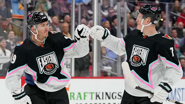 Feb 4, 2023; Sunrise, Florida, USA; Atlantic Division forward Matthew Tkachuk (19) of the Florida Panthers fist bumps Atlantic Division forward Brady Tkachuk (71) of the Ottawa Senators during the second period of a semifinal game during the 2023 NHL All-Star Game at FLA Live Arena. Mandatory Credit: Jasen Vinlove-Imagn Images