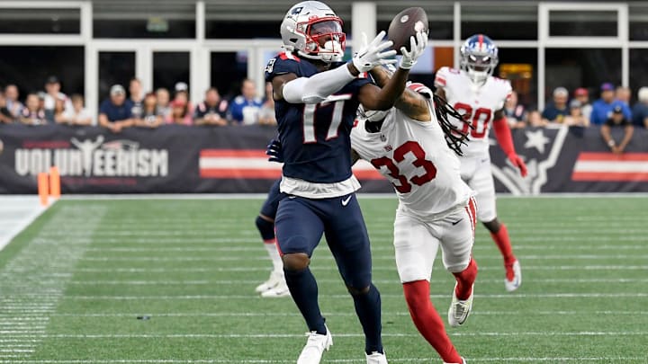 Aug 11, 2022; Foxborough, Massachusetts, USA; New England Patriots wide receiver Kristian Wilkerson (17) makes a catch against New York Giants cornerback Aaron Robinson (33) during the first half of a preseason game at Gillette Stadium.