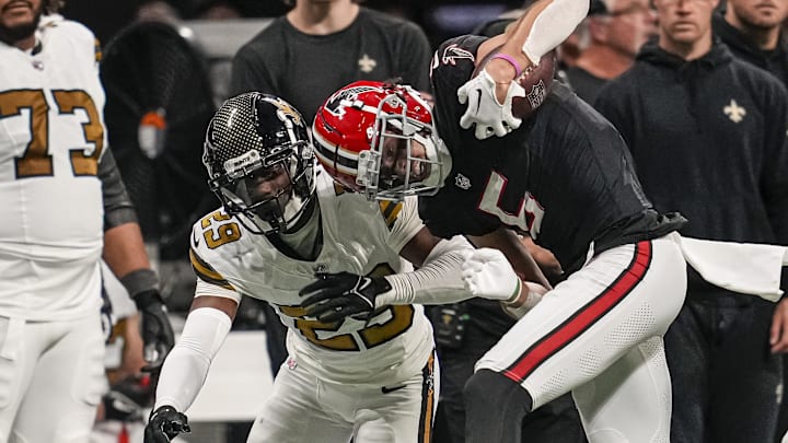 Atlanta Falcons wide receiver Drake London (5) is tackled by New Orleans Saints cornerback Paulson Adebo (29) Atlanta Falcons wide receiver Drake London (5) is tackled by New Orleans Saints cornerback Paulson Adebo (29)