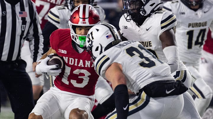 Indiana Hoosiers wide receiver Elijah Sarratt (13) runs the ball while Purdue Boilermakers defensive back Dillon Thieneman (31) defends in the first half at Memorial Stadium.
