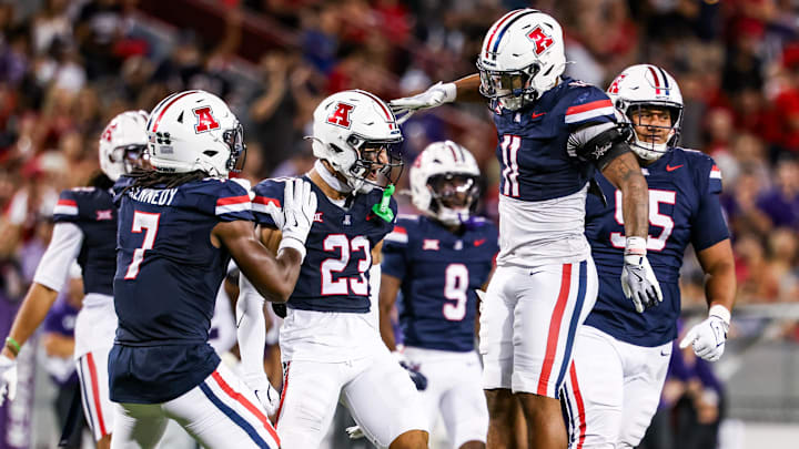 Sep 12, 2025; Tucson, Arizona, USA; Arizona Wildcats defensive back Gavin Hunter (23) celebrates with teammate during the fourth quarter against the Kansas State Wildcats at Arizona Stadium. Mandatory Credit: Aryanna Frank-Imagn Images