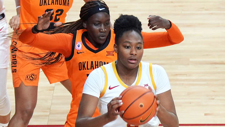 Iowa State Cyclones' forward Alisa Williams (3) looks for a pass around Oklahoma State Cowgirls forward Achol Akot (11) during the third quarter in the senior day women basketball at Hilton Coliseum on February. 25, 2026, in Ames, Iowa.