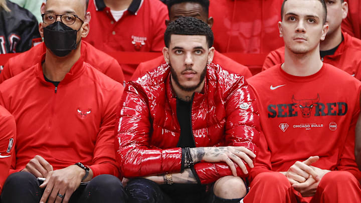 Apr 22, 2022; Chicago, Illinois, USA; Chicago Bulls guard Lonzo Ball (center) looks on from the bench during the second half of game three of the first round for the 2022 NBA playoffs against the Milwaukee Bucks at United Center. Mandatory Credit: Kamil Krzaczynski-USA TODAY Sports Apr 22, 2022; Chicago, Illinois, USA; Chicago Bulls guard Lonzo Ball (center) looks on from the bench during the second half of game three of the first round for the 2022 NBA playoffs against the Milwaukee Bucks at United Center. Mandatory Credit: Kamil Krzaczynski-USA TODAY Sports