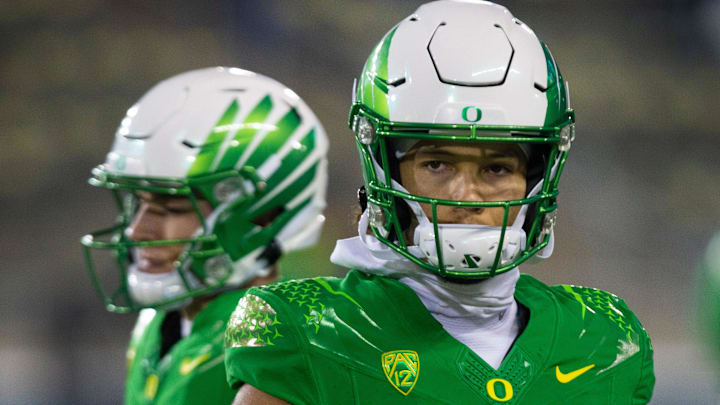 Oregon's Ty Thompson, right, and Bo Nix, left, warm up before the game against Utah in final home game of season at Autzen Stadium.

Ncaa Football Oregon Utah Football Utah At Oregon