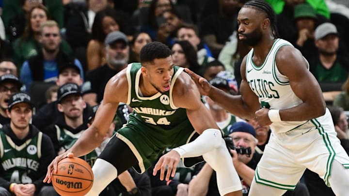 Nov 10, 2024; Milwaukee, Wisconsin, USA;  Milwaukee Bucks forward Giannis Antetokounmpo (34) is guarded by Boston Celtics forward Jaylen Brown (7) in the fourth quarter at Fiserv Forum. Mandatory Credit: Benny Sieu-Imagn Images