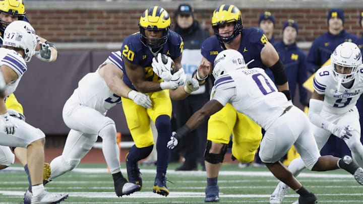 Nov 23, 2024; Ann Arbor, Michigan, USA;  Michigan Wolverines running back Kalel Mullings (20) runs the ball against the Northwestern Wildcats in the first half at Michigan Stadium. Mandatory Credit: Rick Osentoski-Imagn Images